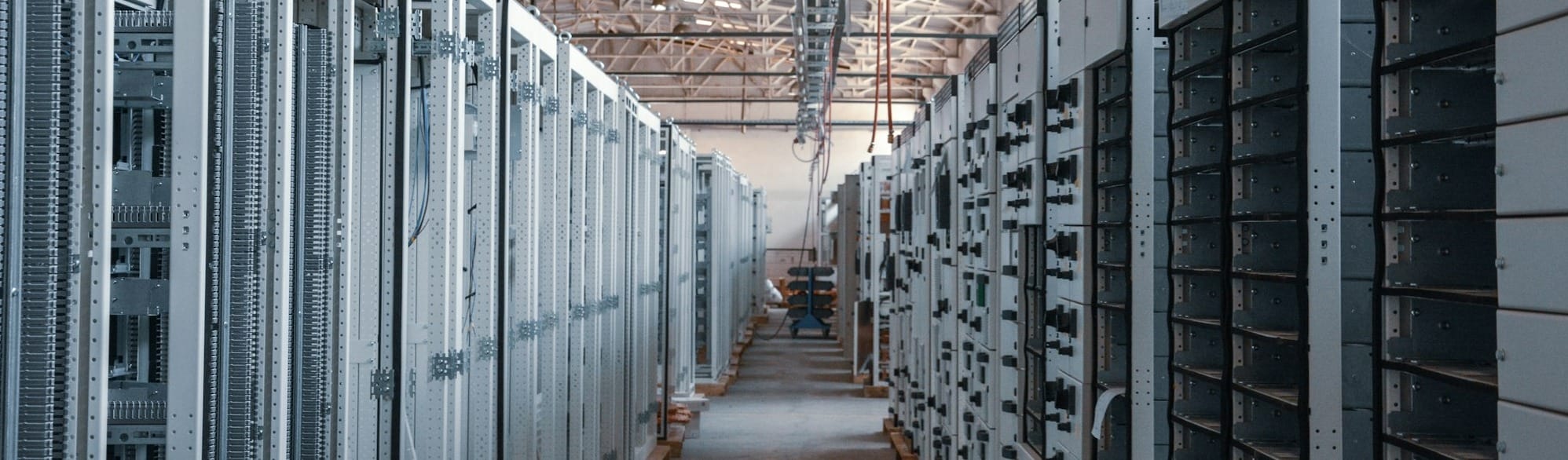 brown wooden hallway with gray metal doors